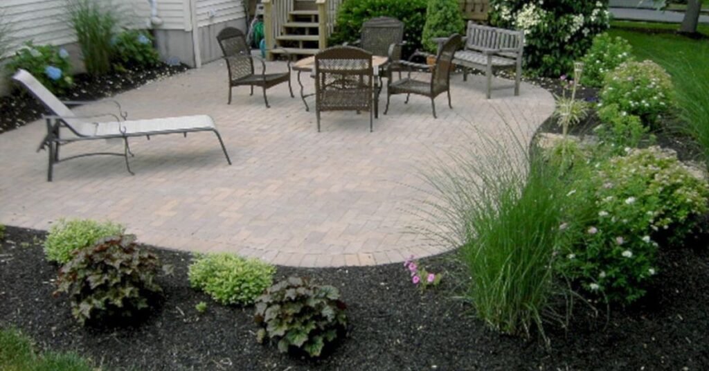 how to landscape around concrete patio