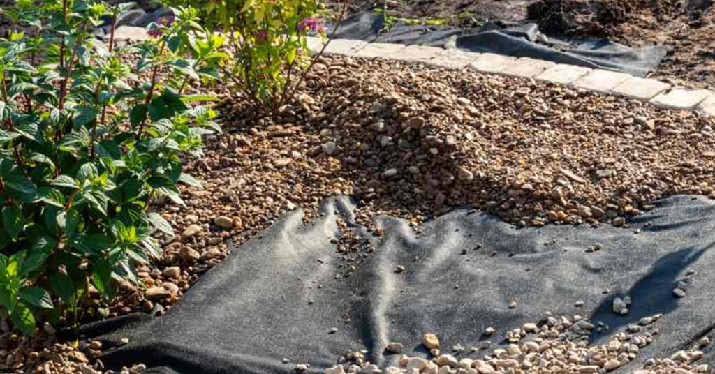 what to put under landscape rock